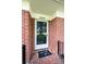 Home's classic brick facade features a welcoming front door entrance and covered porch at 2309 13Th Street Ne Dr, Hickory, NC 28601