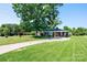Charming home showcasing a beautifully landscaped front yard and a spacious driveway for convenient parking for you and your guests at 2309 13Th Street Ne Dr, Hickory, NC 28601