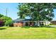 Charming brick ranch home featuring a lush front yard and attached carport at 2309 13Th Street Ne Dr, Hickory, NC 28601