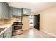 Galley kitchen with stainless steel appliances and access to an outside entrance at 2309 13Th Street Ne Dr, Hickory, NC 28601