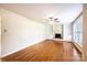Spacious living room with hardwood floors, built-in shelving, and lots of natural light at 2309 13Th Street Ne Dr, Hickory, NC 28601