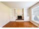 Charming living room features hardwood floors, large windows, a fireplace, and built-in bookshelves at 2309 13Th Street Ne Dr, Hickory, NC 28601