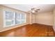 Bright and airy living room features hardwood floors, a ceiling fan, and large window at 2309 13Th Street Ne Dr, Hickory, NC 28601