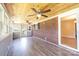 Cozy sunroom with wood-paneled ceiling, brick wall, and views of the backyard at 2309 13Th Street Ne Dr, Hickory, NC 28601