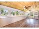 Bright sunroom with multiple windows and a ceiling fan overlooking the lush landscape at 2309 13Th Street Ne Dr, Hickory, NC 28601