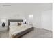 Modern bedroom with a plush bed, carpeted floors and neutral decor at 239 Paige Rd, Kings Mountain, NC 28086