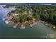 Aerial view features waterfront properties with private docks and lake access surrounded by trees at 2541 Penngate Dr, Sherrills Ford, NC 28673