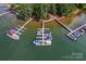 Aerial view of a boat dock on the lake surrounded by dense green trees at 2541 Penngate Dr, Sherrills Ford, NC 28673