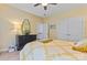 Bedroom with yellow walls, closet, and black dresser at 2541 Penngate Dr, Sherrills Ford, NC 28673