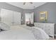Bedroom with gray walls, closet, and white dresser at 2541 Penngate Dr, Sherrills Ford, NC 28673