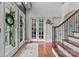 Grand foyer featuring tiled entryway, staircase and glass french doors at 2541 Penngate Dr, Sherrills Ford, NC 28673
