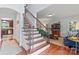 Elegant foyer with hardwood floors and staircase adjacent to the living room at 2541 Penngate Dr, Sherrills Ford, NC 28673