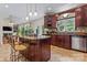 Gourmet kitchen with center island, cherry cabinets, granite counters, and modern appliances at 2541 Penngate Dr, Sherrills Ford, NC 28673