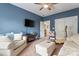 Comfortable living room with blue walls and white furniture at 2541 Penngate Dr, Sherrills Ford, NC 28673