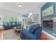 Inviting living room with blue couches, fireplace, and staircase views at 2541 Penngate Dr, Sherrills Ford, NC 28673