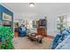 Cozy living room with hardwood floors, blue furniture, fireplace and a hutch at 2541 Penngate Dr, Sherrills Ford, NC 28673