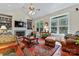 Inviting living room featuring hardwood floors, a ceiling fan, and large windows at 2541 Penngate Dr, Sherrills Ford, NC 28673