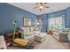 Comfortable living room with blue walls, a ceiling fan, and white furniture at 2541 Penngate Dr, Sherrills Ford, NC 28673