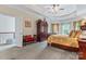Large primary bedroom with a tray ceiling, neutral decor, and ample natural light at 2541 Penngate Dr, Sherrills Ford, NC 28673