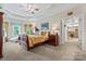 Spacious main bedroom featuring tray ceilings, ceiling fan, and ensuite bathroom at 2541 Penngate Dr, Sherrills Ford, NC 28673
