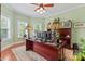 Bright office with large desk, Tiffany lamps, and window views at 2541 Penngate Dr, Sherrills Ford, NC 28673