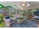 Bright sunroom with abundant natural light, stylish furniture, and decorative plants at 2541 Penngate Dr, Sherrills Ford, NC 28673