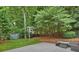 Backyard featuring a basketball court, storage shed and patio at 314 Southern Cross Ln, Matthews, NC 28105