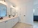 Beautiful bathroom with dual vanities, modern fixtures, and plenty of counter space at 314 Southern Cross Ln, Matthews, NC 28105