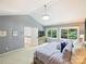 Bright bedroom featuring a vaulted ceiling, carpet, large windows, and comfortable furnishings at 314 Southern Cross Ln, Matthews, NC 28105