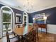Elegant dining room featuring a large table, classic decor, and ample natural light at 314 Southern Cross Ln, Matthews, NC 28105