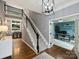 Spacious foyer with hardwood floors, staircase, and a view of the study and dining area at 314 Southern Cross Ln, Matthews, NC 28105