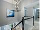 Spacious foyer with a modern chandelier, staircase, and views of the entrance and hallway at 314 Southern Cross Ln, Matthews, NC 28105