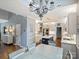 Spacious kitchen with white cabinets, stainless steel appliances, and a stylish blue island at 314 Southern Cross Ln, Matthews, NC 28105