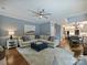 Inviting living room features a large sectional sofa, stylish rug, and open layout to the dining area at 314 Southern Cross Ln, Matthews, NC 28105
