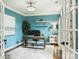 Well-lit study featuring a desk, shelves, and a comfortable workspace with natural light at 314 Southern Cross Ln, Matthews, NC 28105