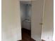 A bathroom featuring a white sink, dark wood floors, and a door ajar at 326 Havencrest Ct, Gastonia, NC 28052