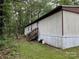 Rear exterior view of manufactured home with wooden stairs to enter the home at 326 Havencrest Ct, Gastonia, NC 28052