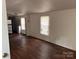 Bright living room with hardwood floors and natural light from the windows at 326 Havencrest Ct, Gastonia, NC 28052