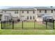 Fenced backyard with lawn and view of rear exterior of home at 3326 Park South Station Blvd, Charlotte, NC 28210