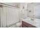 Clean bathroom with shower and tub combination, white vanity, and neutral decor at 3326 Park South Station Blvd, Charlotte, NC 28210