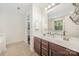 Bright bathroom features double sinks, a large mirror, and a walk-in closet for convenient storage at 3326 Park South Station Blvd, Charlotte, NC 28210