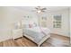 Cozy bedroom with a neutral color palette, soft bedding, and natural light from two windows at 3326 Park South Station Blvd, Charlotte, NC 28210