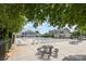 Community pool featuring plenty of lounge chairs, picnic tables, and a bathhouse, perfect for outdoor relaxation at 3326 Park South Station Blvd, Charlotte, NC 28210