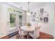 Cozy dining area with hardwood floors, modern light fixture, and french doors leading to the outside at 3326 Park South Station Blvd, Charlotte, NC 28210