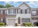 Charming townhome exterior with neutral siding, brown shutters, and a one-car garage at 3326 Park South Station Blvd, Charlotte, NC 28210