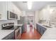 Modern kitchen with stainless steel appliances, two-tone cabinets, and stylish backsplash at 3326 Park South Station Blvd, Charlotte, NC 28210