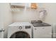Modern laundry room features new washer and dryer, and storage shelving at 3326 Park South Station Blvd, Charlotte, NC 28210