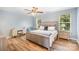 Serene main bedroom featuring natural light, a ceiling fan, and neutral-toned decor at 3326 Park South Station Blvd, Charlotte, NC 28210