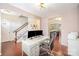 Light-filled home office with hardwood floors and view into the kitchen and stairway at 3326 Park South Station Blvd, Charlotte, NC 28210