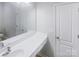 Bright bathroom with a large mirror, white vanity, and a clean, modern design at 4122 Munson Dr, Charlotte, NC 28215